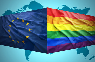 Waving  European Union and Gay flags
