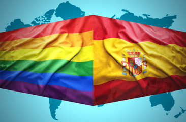 Waving Spanish and Gay flags