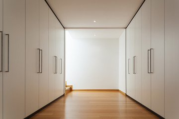 Fototapeta na wymiar Interior, long corridor with wardrobes