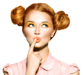 Joyful teen girl with freckles, funny hairstyle choosing