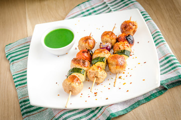Grilled chicken skewers with zucchini and cherry tomatoes