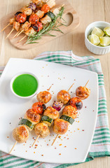 Grilled chicken skewers with zucchini and cherry tomatoes