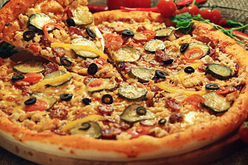 pizza with a slice cut, delicious pastries