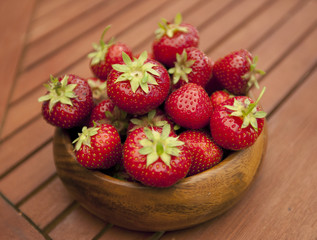 Fresh strawberries in wood bowl