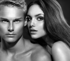 Sexy couple. Young man with his girlfriend. B&W portrait