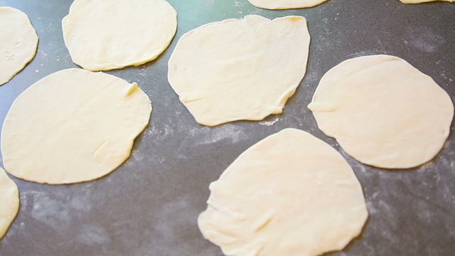 Panning over lots of unleavened flatbread chapatis