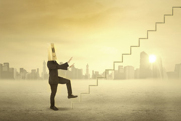 Businessman walking forward to sky 1