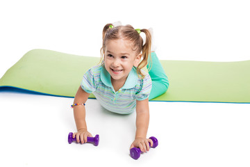 Girl doing exercises with dumbbells