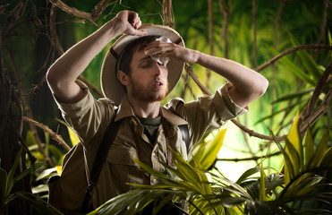 Exhausted young explorer in the jungle