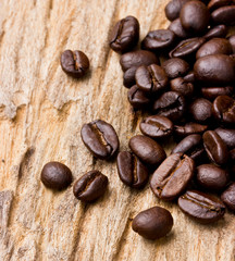 Coffee beans on wood background