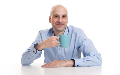 man drinking a cup of coffee or tea