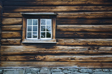 Dark timbered wooden wall with window