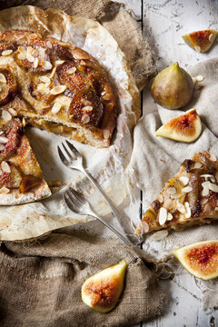 rustic stuffed figs pie covered with almonds and candied figs