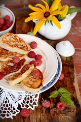 Fat pancakes with fresh raspberries