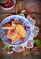 Fat pancakes with fresh raspberries