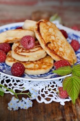 Fat pancakes with fresh raspberries