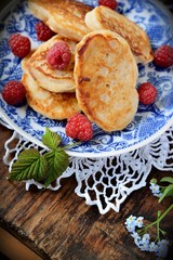 Fat pancakes with fresh raspberries