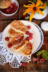 Fat pancakes with fresh raspberries