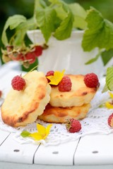 small cheesecakes with raspberry in the country