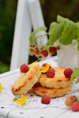 small cheesecakes with raspberry in the country