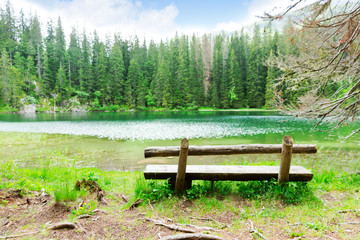 Fototapeta na wymiar Lake and wooden bench