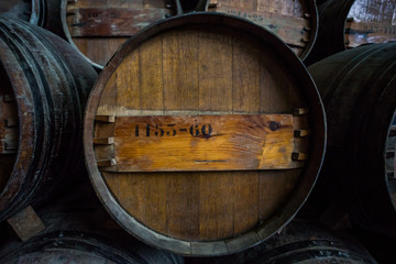 Wine barrels stacked in the cellar of the Quinta da Bacalhoa win