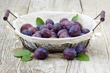 fresh plums in a basket