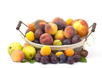 fresh fruits in a basket on white background