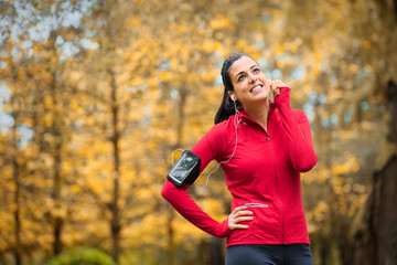 Sporty fitness woman with smartphone armband