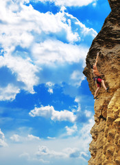 man climbing on rock