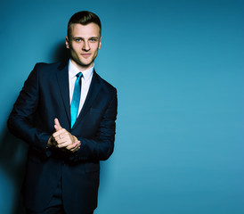 Fashion portrait of elegant young handsome man in classic costum