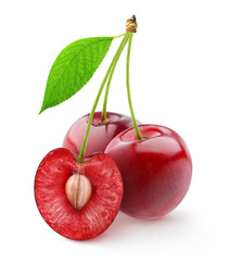 Isolated cherries. Three sweet cherry fruits, one cut in half, with leaf on white background