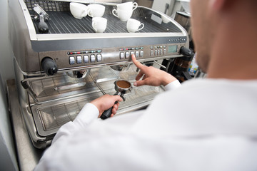 Barista doing your coffee