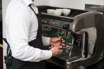 Barista doing your coffee