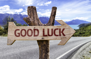 Good Luck wooden sign with a street background