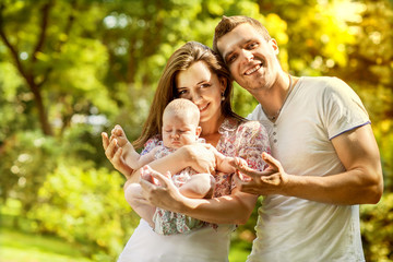 parents with baby in park