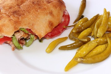 Kebab and fresh chillies on a plate