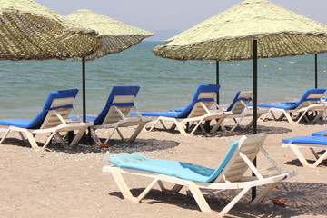 Sunbeds and umbrellas at calis beach,turkey 2014