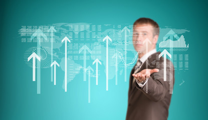 Businessman with graphs and arrows