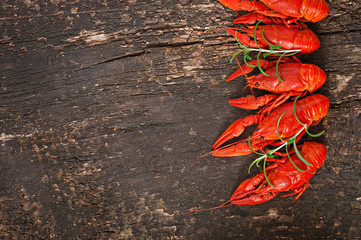 Fresh boiled crawfish on the old wooden background