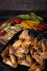 Chicken wings and  bbq vegetables 
