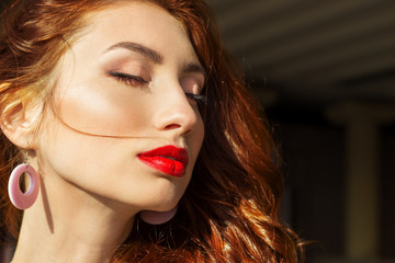 sexy girl with red hair with big red lips with makeup