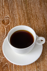 Cup of coffee on wooden table