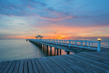 Landscape of Wooded bridge in the port between sunrise