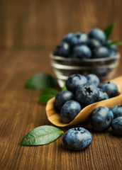 Fresh blueberries in a wooden scoop