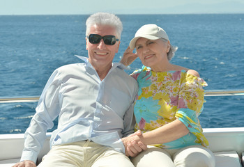 Elderly couple have a ride in a boat