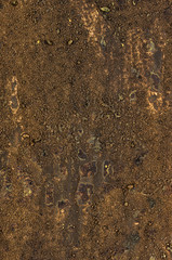Detailaufnahme einer Leinwand mit Acrylfarbe und Sand