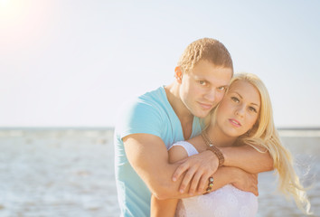 Fototapeta na wymiar Romantic young couple near the sea.