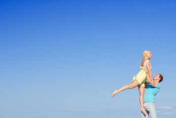 Fototapeta premium Picture of romantic young couple dancing. Space for text.