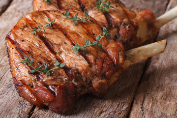 two hot juicy pork steak with thyme horizontal close-up